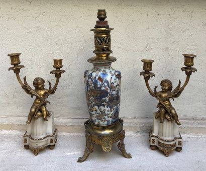 null Pair of two-light alabaster and gilt bronze candlesticks decorated with putti

Misses...