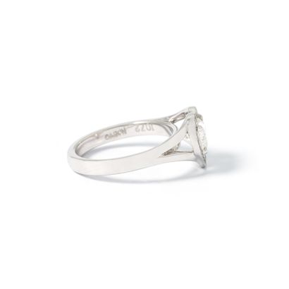 null Koenig. 18K white gold 750‰ ring centered with a heart diamond weighing 0.91...