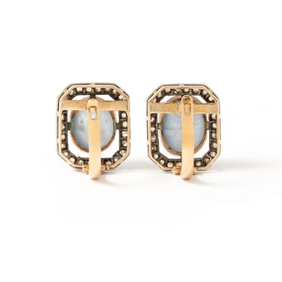 null Pair of 14K yellow gold 585‰ and silver 800‰ earrings respectively centered...