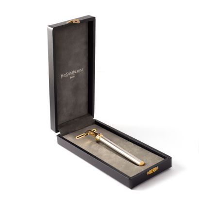 null Yves Saint Laurent. Razor (without blade) in steel and gilded metal set with...