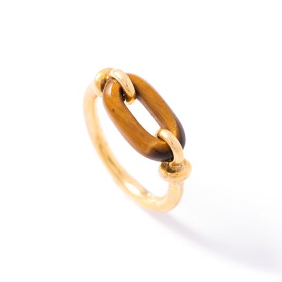 null Cartier (attributed to). 18K yellow gold 750‰ ring holding a tiger's eye motif.

Bears...