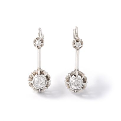 null Pair of 18K white gold 750‰ earrings set with old and rose-cut diamonds.

French...