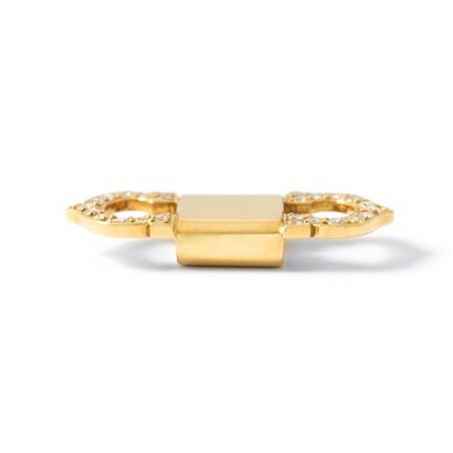 null Cartier (attributed to). 18K yellow gold 750‰ motif set with round diamonds.

Bears...