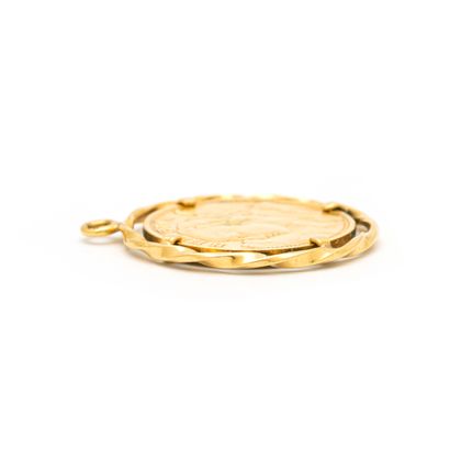 null 18K yellow gold 750‰ pendant holding a 20 Swiss franc Vreneli-Helvetia coin....
