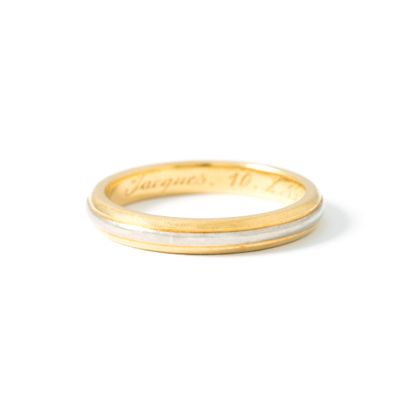 null 18K yellow and white gold 750‰ wedding band with interior engraving. Dated 1955.

Slight...