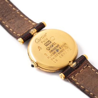 null Cartier. Must collection. Round-shaped 925‰ gold-plated silver wristwatch, burgundy...