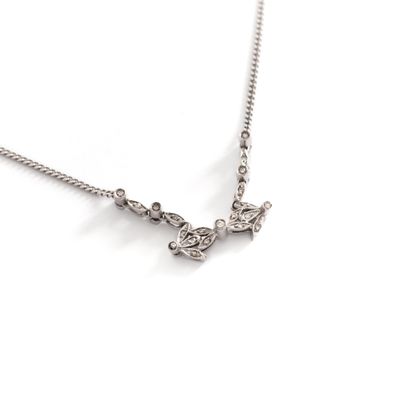 null Necklace chain in 18K white gold 750‰ holding a central motif set with round...