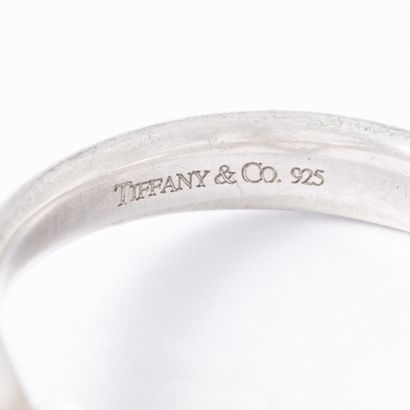 null Tiffany's and Co. Peretti Collection.

925‰ silver ring set with two round diamonds....