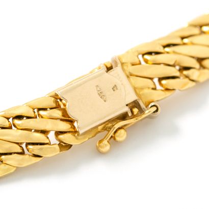 null Collier et bracelet en or jaune 18K 750‰ maille anglaise articulée.

Huit de...