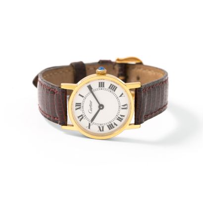 null Cartier. Solo collection. Gold-plated metal wristwatch, round shape, white background...