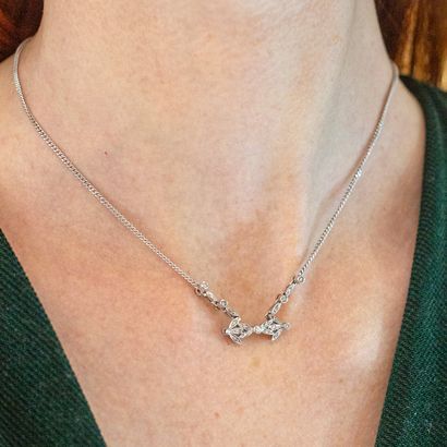 null Necklace chain in 18K white gold 750‰ holding a central motif set with round...