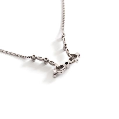 null Necklace chain in 18K white gold 750‰ holding a central motif set with round...