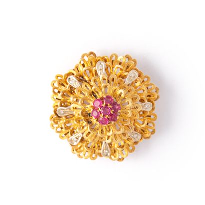 null 18K yellow and white gold 750‰ brooch set with 8/8 cut diamonds and red stones.

Circa...