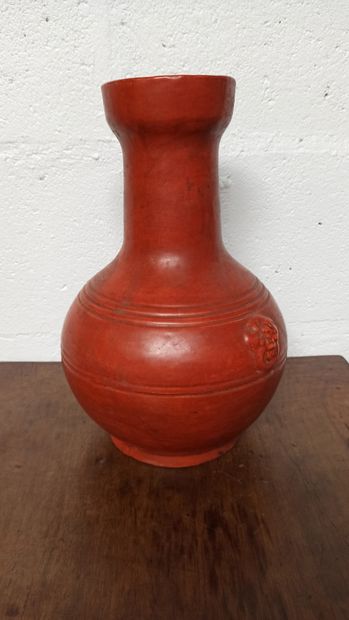 null Baluster vase with flared neck in red glazed ceramic in the Chinese taste, holds...