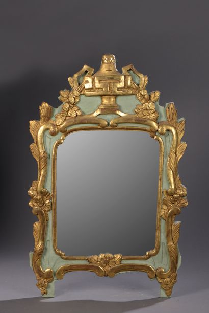 null Mirror in a molded wood frame, carved and lacquered green and gilded, decorated...