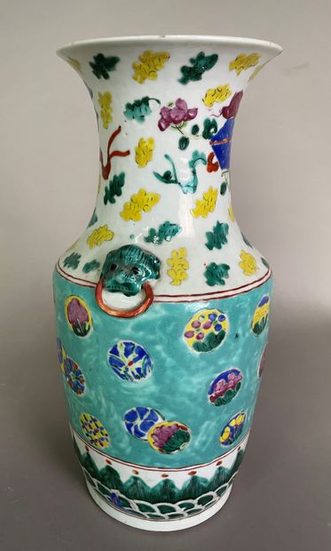 null Porcelain baluster vase decorated with polychrome enamels of small medallions...