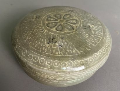 null Stoneware covered box with celadon glaze, underglaze decoration of floral motifs....