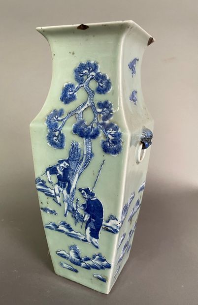 null A stoneware quadragonal vase decorated in blue on celadon glaze with characters...