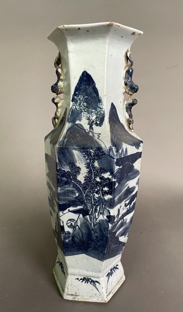 null Hexagonal stoneware vase decorated in blue underglaze with characters including...