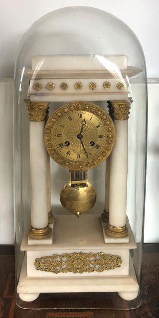 null Portico clock in white marble and gilt bronze, the bronze dial indicating the...