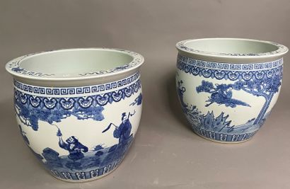 null Two porcelain fishbowls decorated in blue underglaze with Immortals under pine...