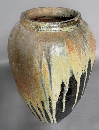 null Large ovoid ceramic vase, cream glaze on black background. 

20th century 

Vertical...