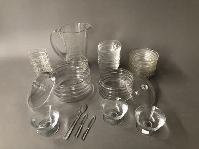 null Lot in crystal and glass including :

- A pitcher decorated with a frieze of...
