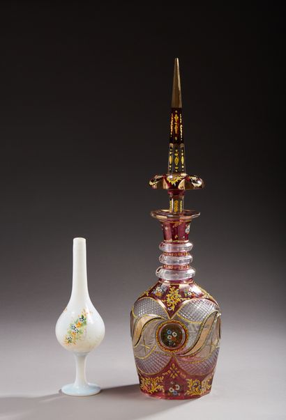 null Large transparent cut crystal decanter, decorated with red, enhanced with gold...
