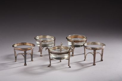 null Four silver salt cellars 1st title 950‰, of round form, standing on three columnar...