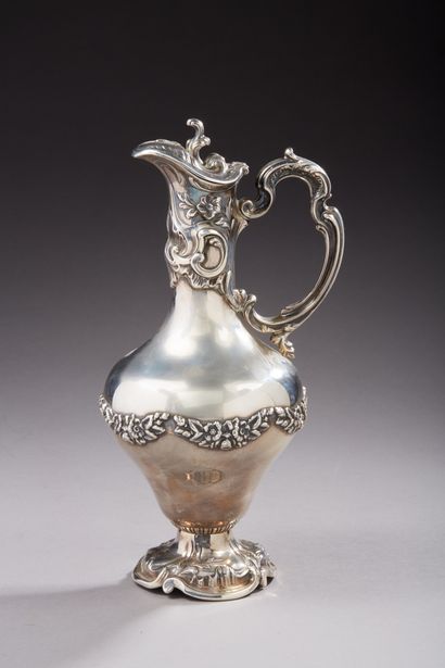 null Silver ewer 1st title 925‰, of rocaille style, decorated with garlands of flowers.Portuguese...