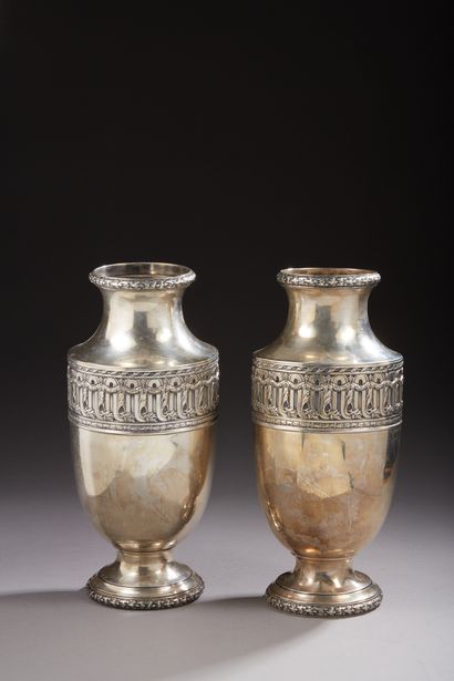 null Pair of silver vases 1st title 950‰, of baluster form, chased with large gadroons...