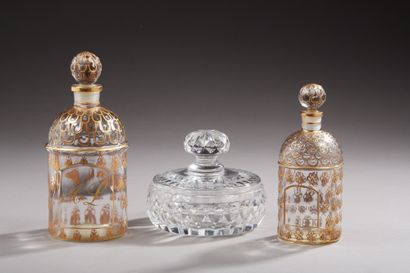 null GUERLAIN - Two glass bottles enhanced with gold, Abeilles model, one engraved...