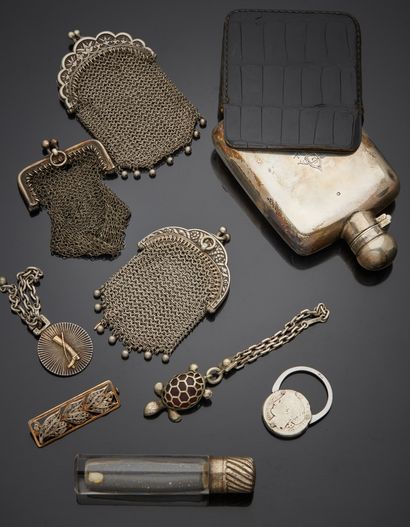 null Lot including a silver 1st title 925‰ flask, figured with its leather pouch;...
