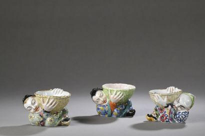 null BAYEUX

THREE porcelain SALESBOARDS featuring reclining Chinese men holding...