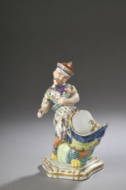 null BAYEUX

Porcelain FIGURE with polychrome decoration representing a Chinese sitting...