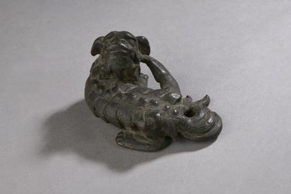 null Bronze CALLIGRAPHIC WEIGHT (or lid socket?), qilin lying down, head turned backwards....