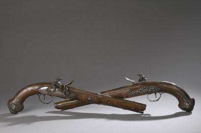 null TWO PISTOLS forming a pair with variations in fittings and decorations, made...
