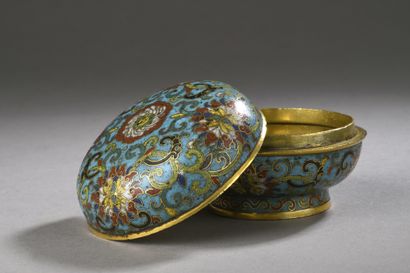 null Box of circular form on short heel in bronze and polychrome cloisonné enamels...