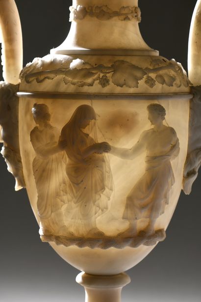 null PAIR OF OVOID VASES covered with carved alabaster pedestals decorated in high...