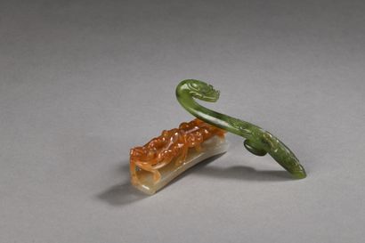null LOT OF TWO jade-nephrite FIBLES, one celadon and rust colored with a dragon...
