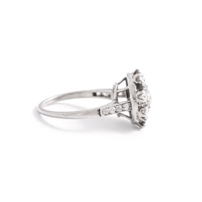 null Platinum 850‰ ring, round shape, set with half-cut diamonds, shouldered by two...