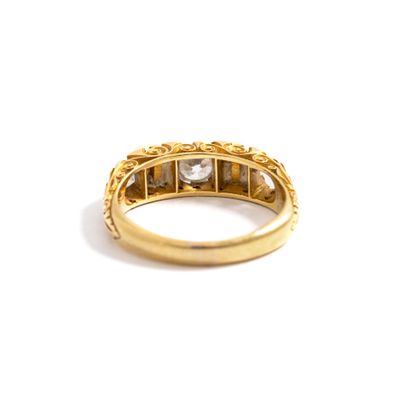 null 18K yellow gold 750‰ garter ring, set with alternating brilliant-cut diamonds...