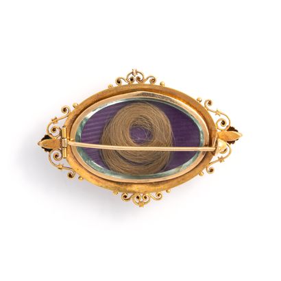 null Polychrome 18K gold 750‰ brooch, oval shape, chased with polychrome flowers,...