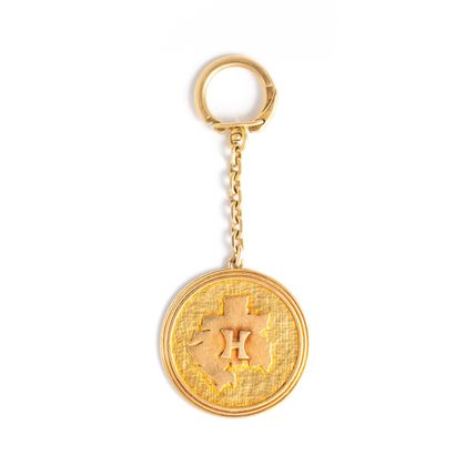 null Keychain in 18K yellow gold 750‰, adorned with a round-shaped plate adorned...