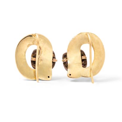 null A pair of 18K yellow gold 750‰ garter-shaped earrings, enameled in blue, the...