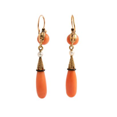 null Pair of 18K yellow gold 750‰ earrings, adorned with a coral* tassel held by...