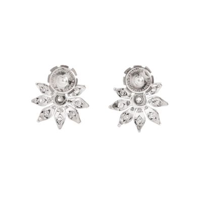 null Pair of 18K white gold 750‰ flower-shaped stud earrings set with brilliant-cut...