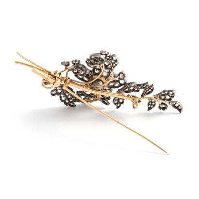 null 18K yellow gold 750‰ and silver 2nd title 800‰ brooch, in the form of a leafy...