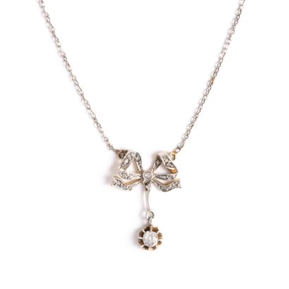 null 18K yellow gold 750‰ and platinum 850‰ forçat link necklace, adorned with a...