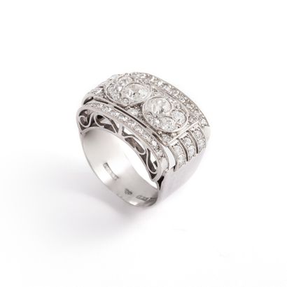 null An 18K white gold 750‰ geometrically patterned ring set with a pavement of old-cut,...